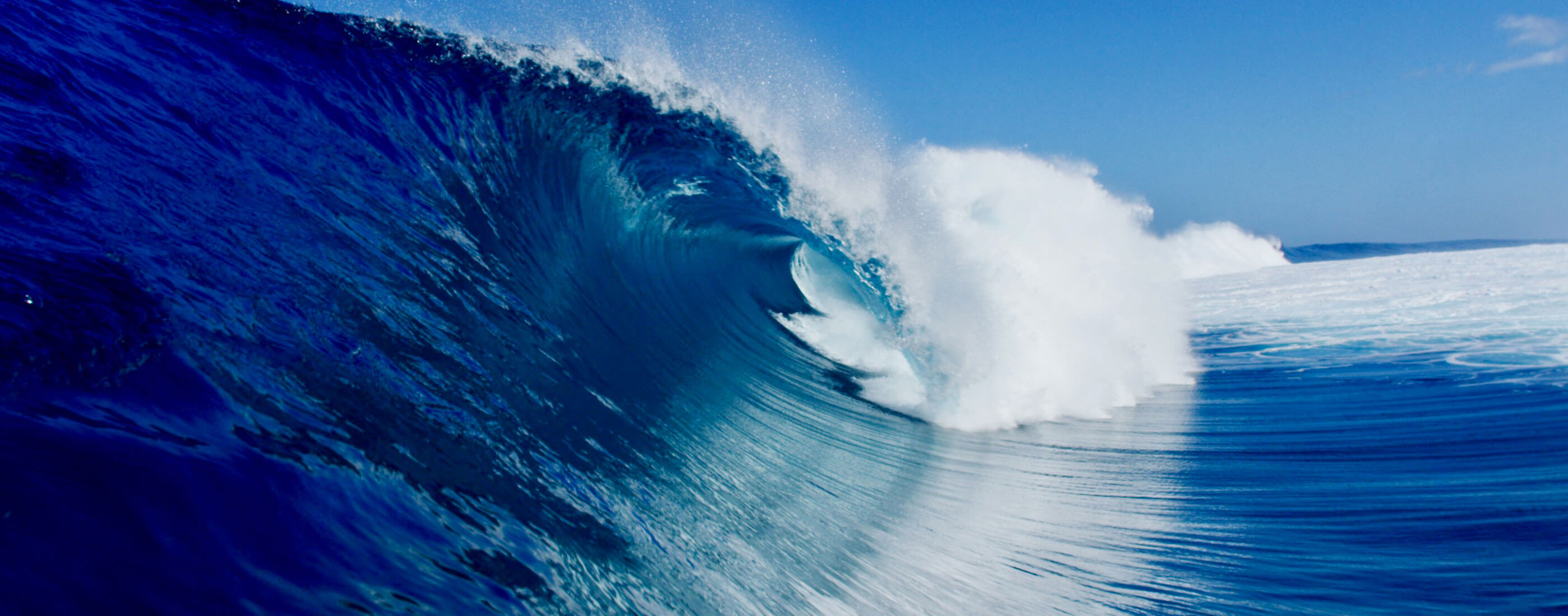 A close up of a big ocean wave